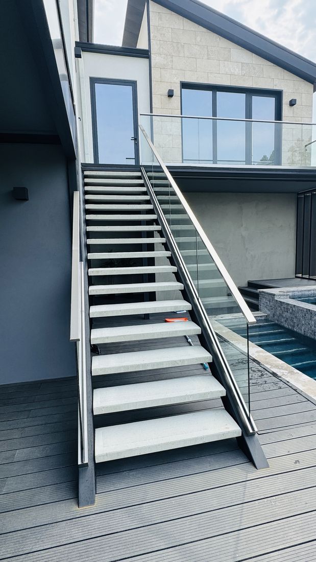 Floating stair with glass railing