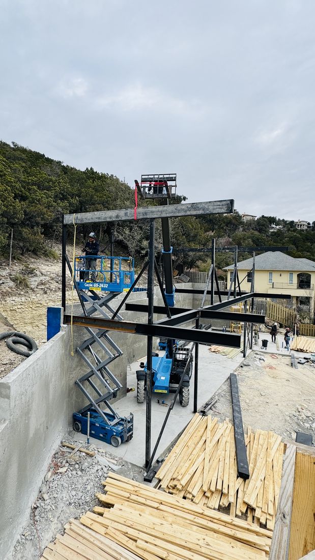 Welder erecting steel frame